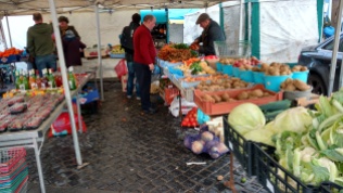 This grocer was selling produce at an open-air market held on Saturdays